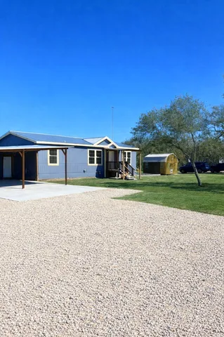 a house view with a garden space