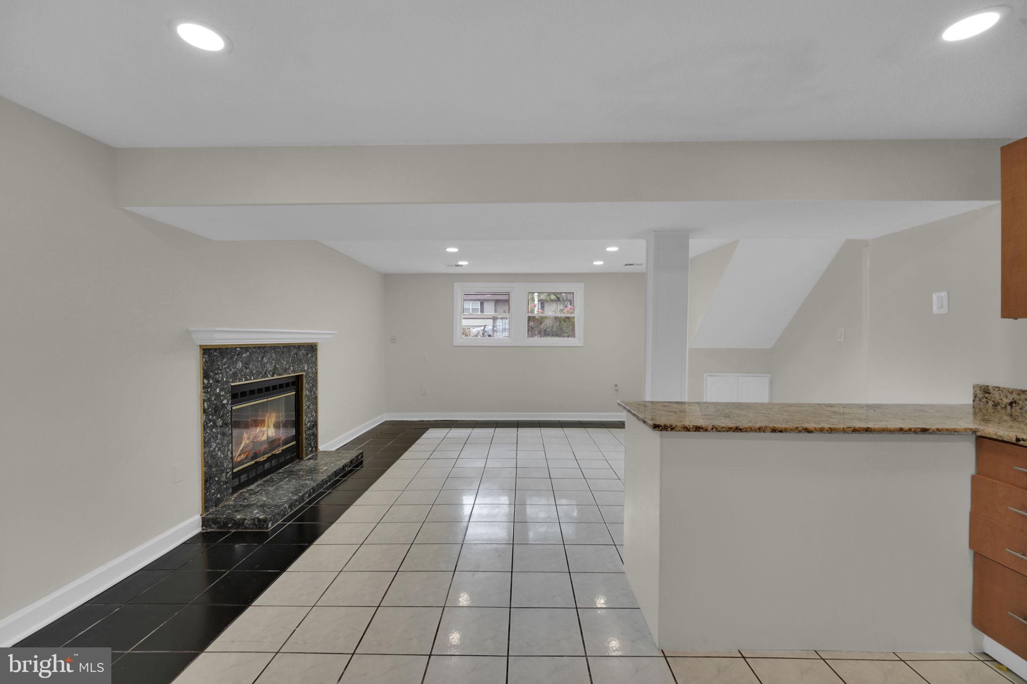 8613 Weems Road Manassas, VA 20110 - Photo 29 of 50 a view of a livingroom with wooden floor and staircase