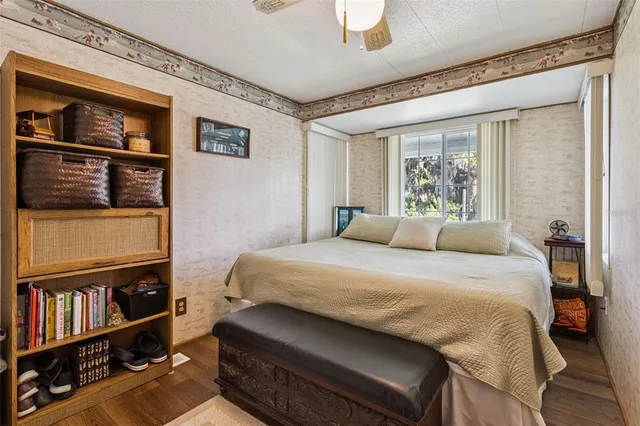 a bedroom with a bed closet and a window