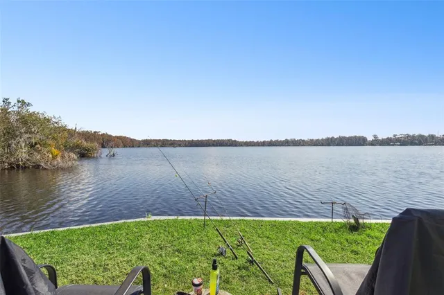 a view of a lake with a big yard