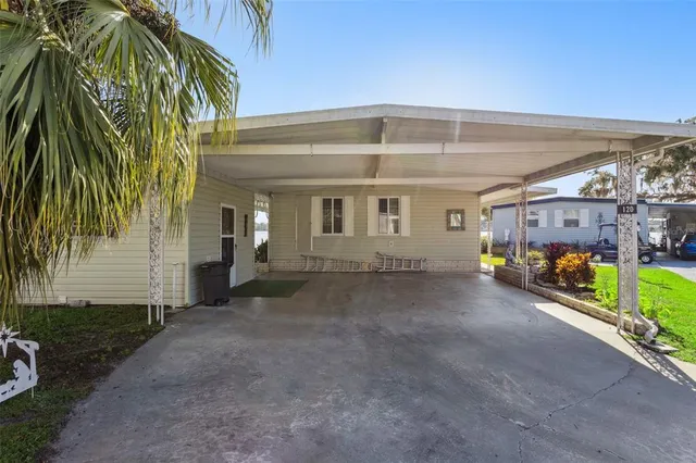 a view of a street with potted plants