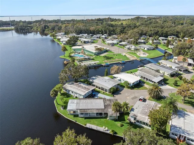 an aerial view of a house with a lake view