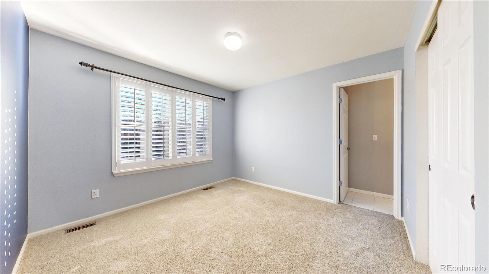 10797 Hickory Ridge Street Highlands Ranch, CO 80126 - Photo 21 of 42 a view of an empty room with a window