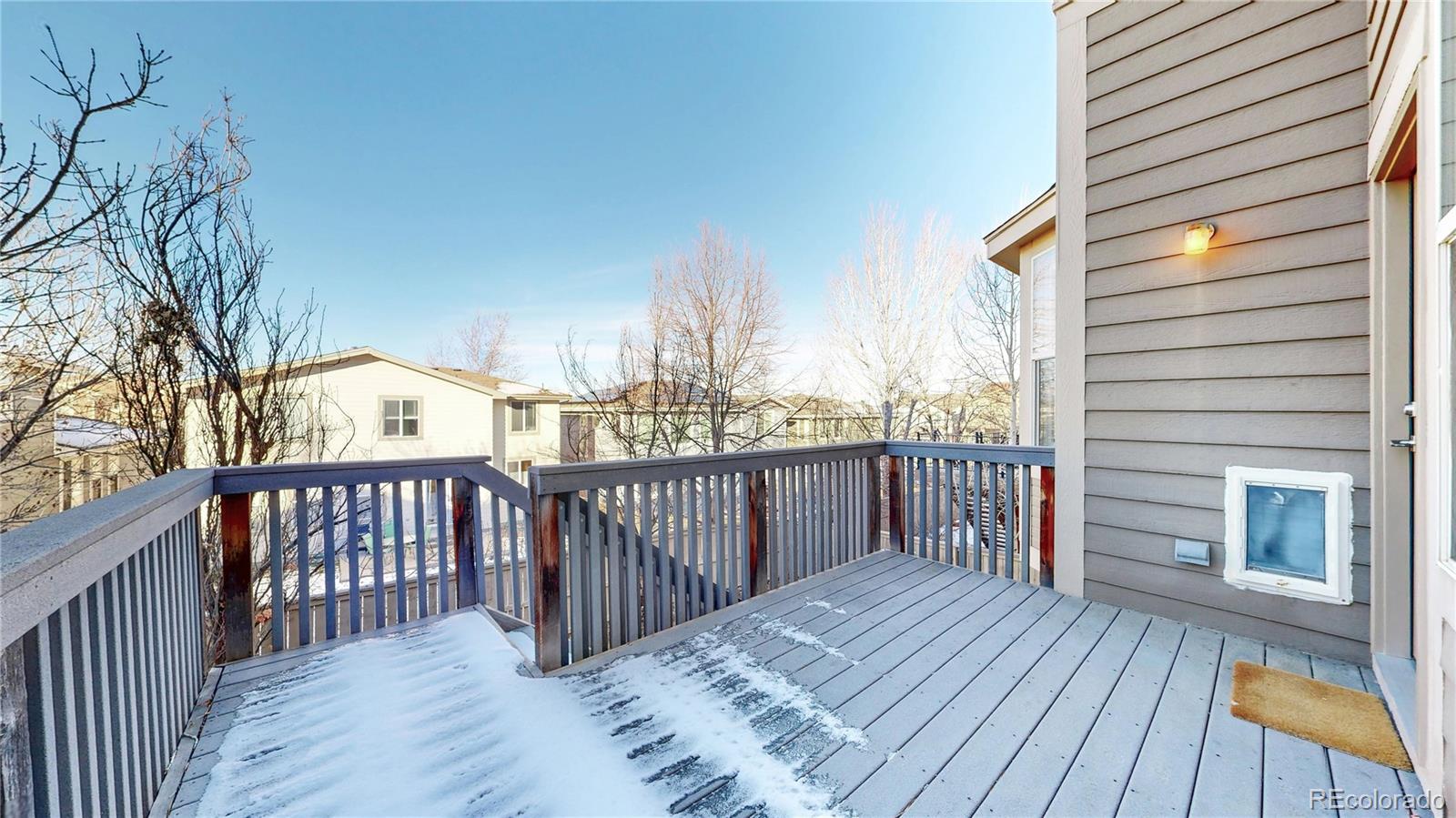 10797 Hickory Ridge Street Highlands Ranch, CO 80126 - Photo 29 of 42 a view of balcony with wooden floor and fence