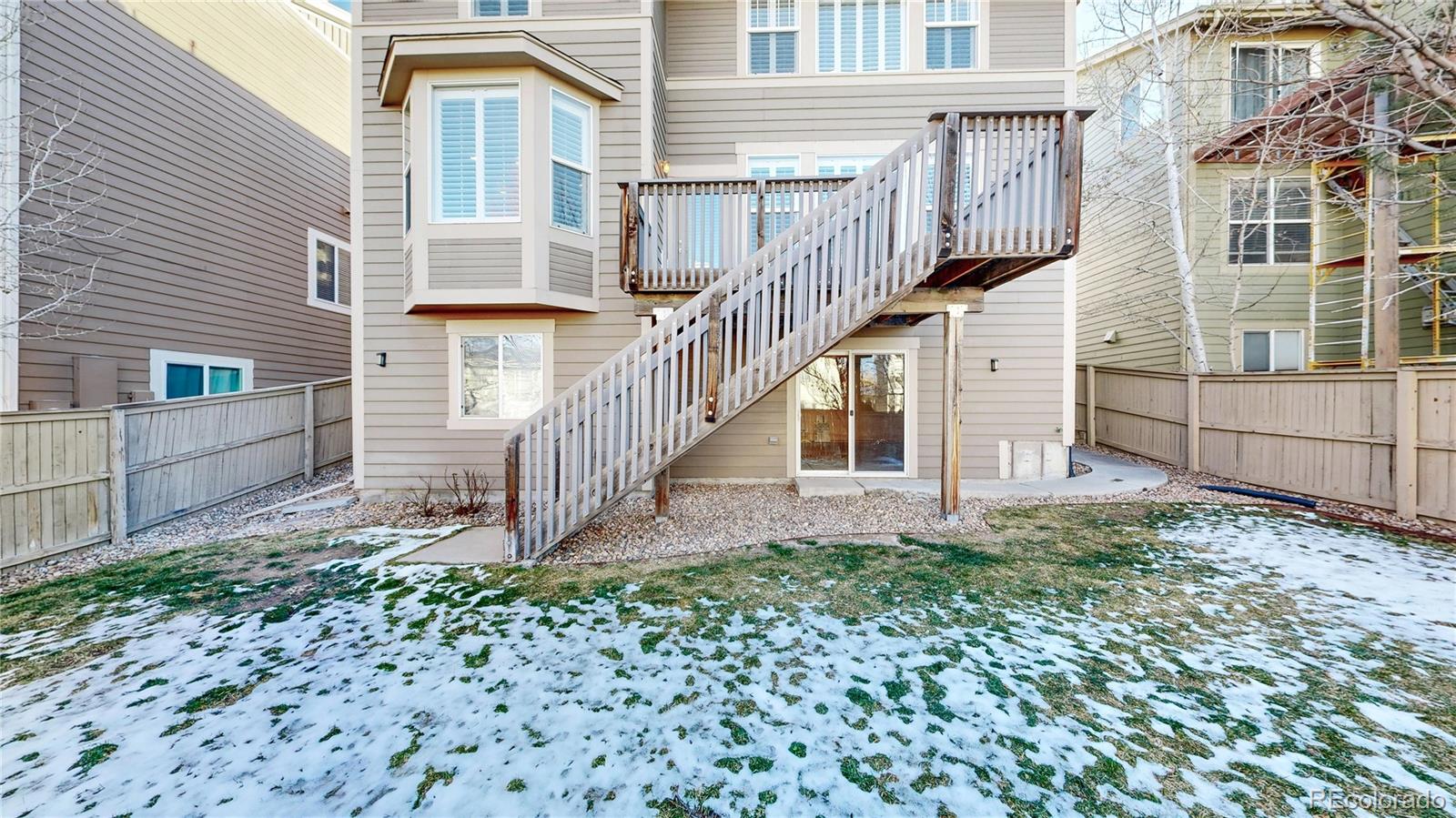 10797 Hickory Ridge Street Highlands Ranch, CO 80126 - Photo 33 of 42 a view of a house with a yard