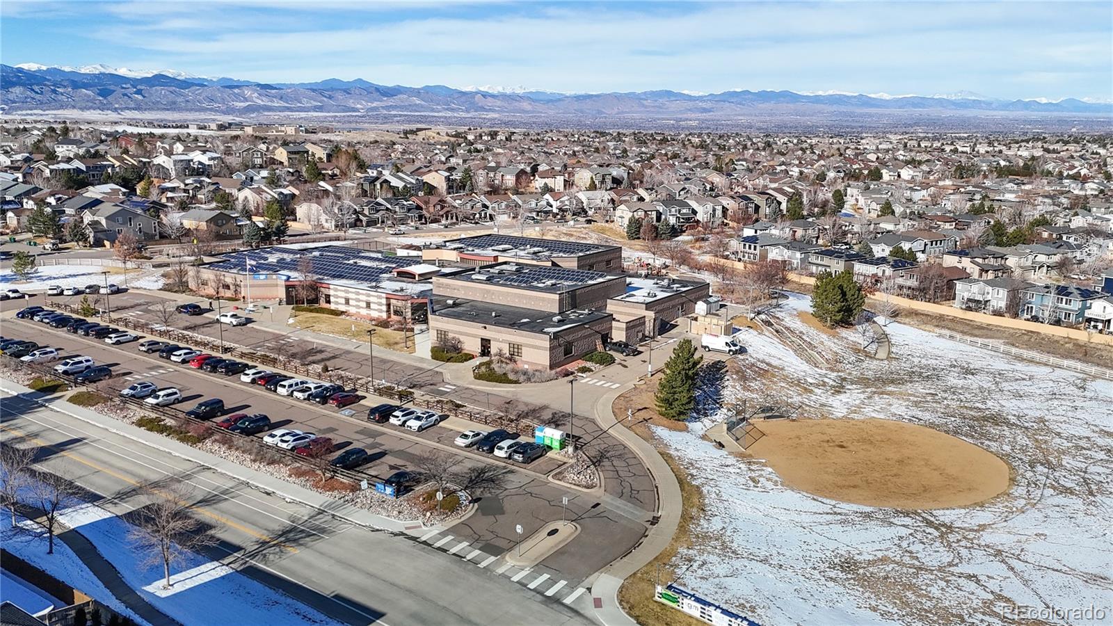 10797 Hickory Ridge Street Highlands Ranch, CO 80126 - Photo 36 of 42 an aerial view of residential houses with outdoor space
