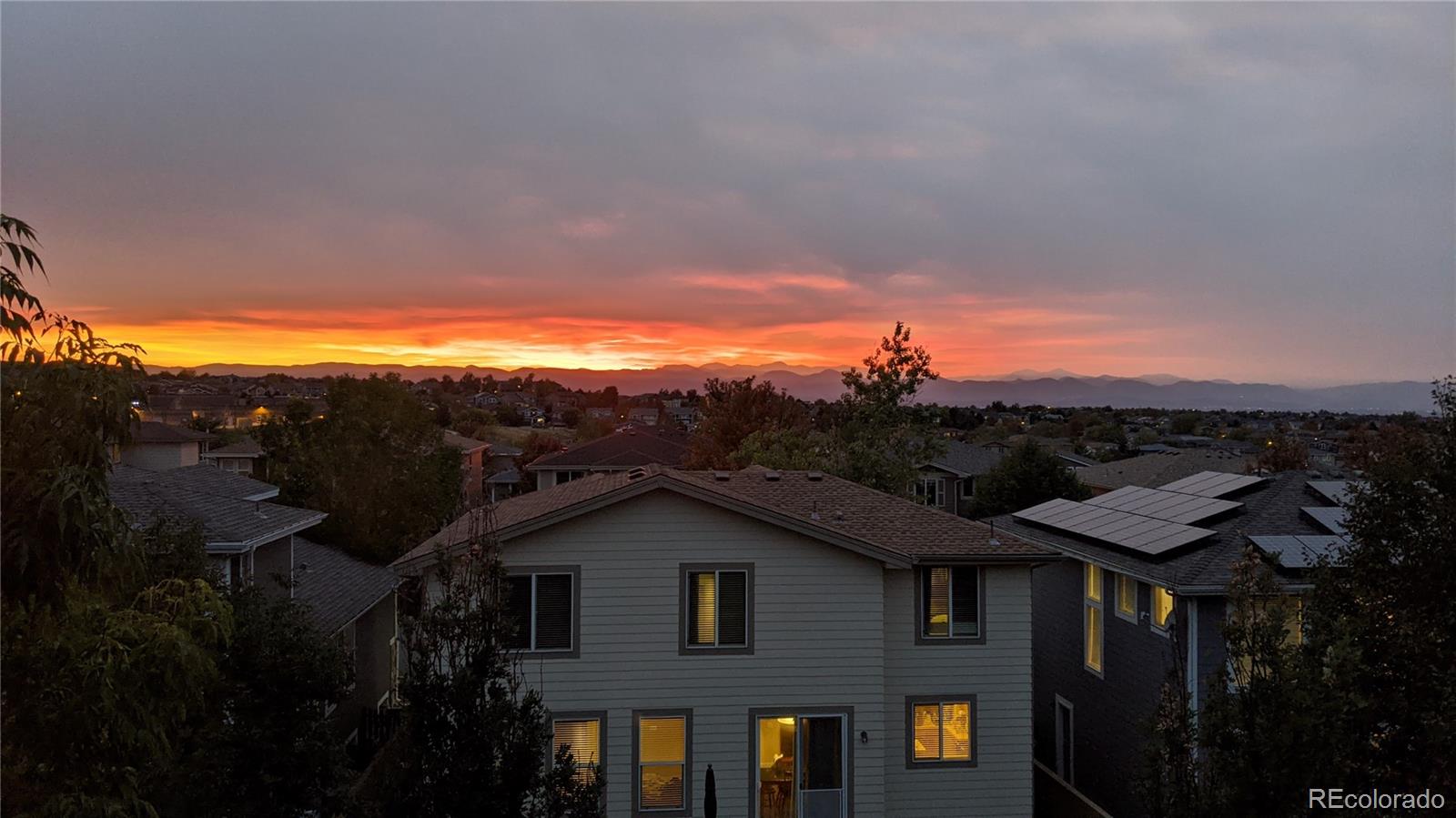 10797 Hickory Ridge Street Highlands Ranch, CO 80126 - Photo 39 of 42 a view of a house with a yard and balcony