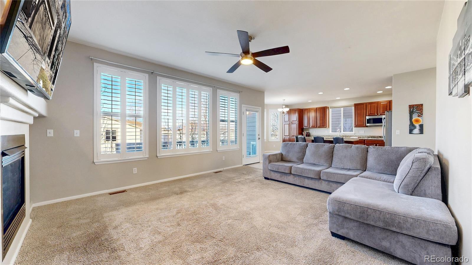 10797 Hickory Ridge Street Highlands Ranch, CO 80126 - Photo 5 of 42 a living room with furniture and a large window