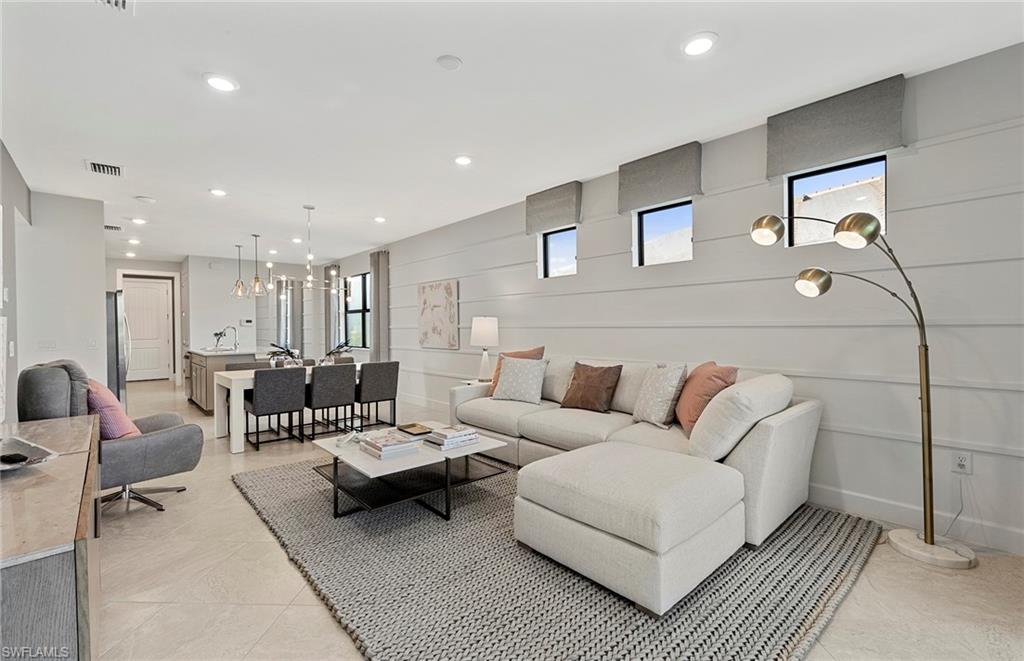 2142 Yellowfin Circle Naples, FL 34114 - Photo 15 of 31 a living room with furniture and a table