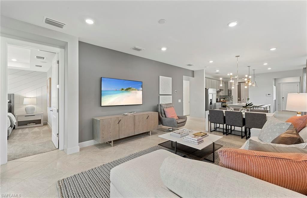 2142 Yellowfin Circle Naples, FL 34114 - Photo 16 of 31 a living room with lots of furniture and view of kitchen