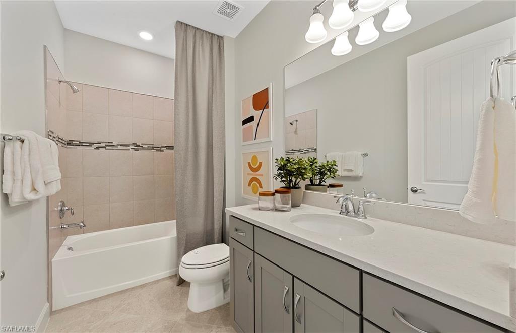 2142 Yellowfin Circle Naples, FL 34114 - Photo 22 of 31 a bathroom with a sink a toilet and shower