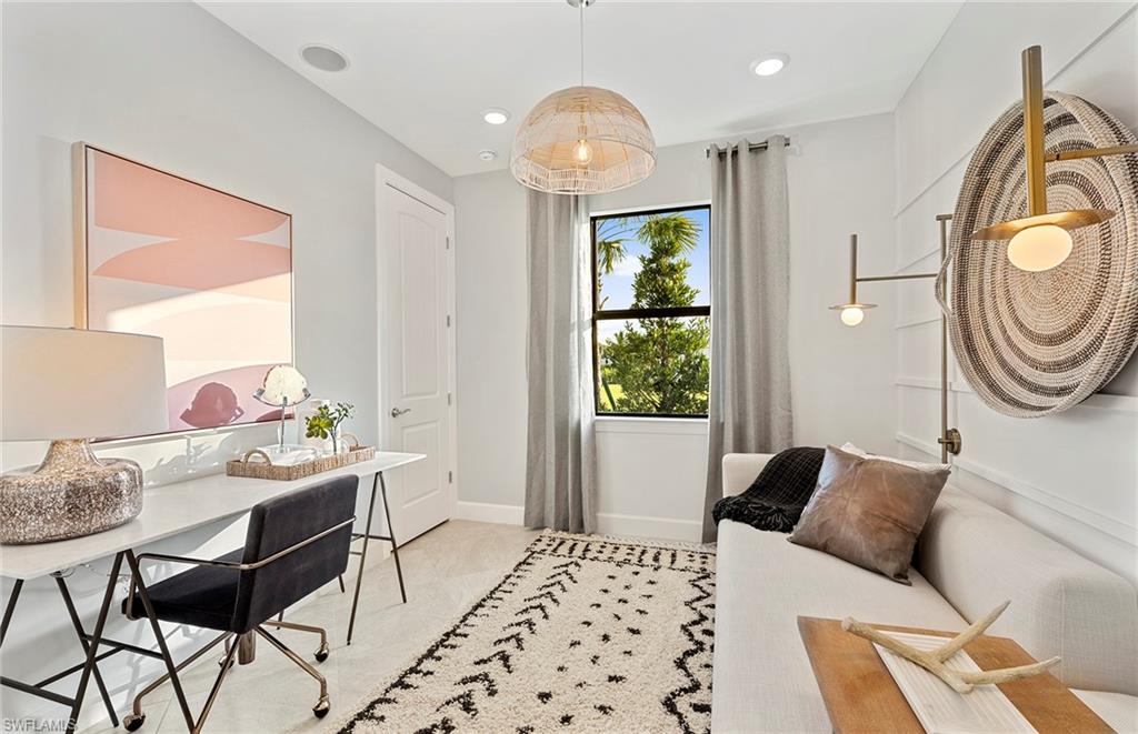 2142 Yellowfin Circle Naples, FL 34114 - Photo 23 of 31 a bedroom with a bed and a chandelier