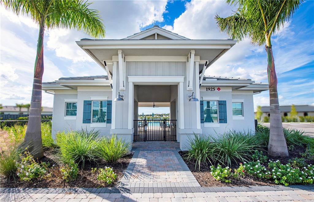 2142 Yellowfin Circle Naples, FL 34114 - Photo 25 of 31 a front view of a house with garden