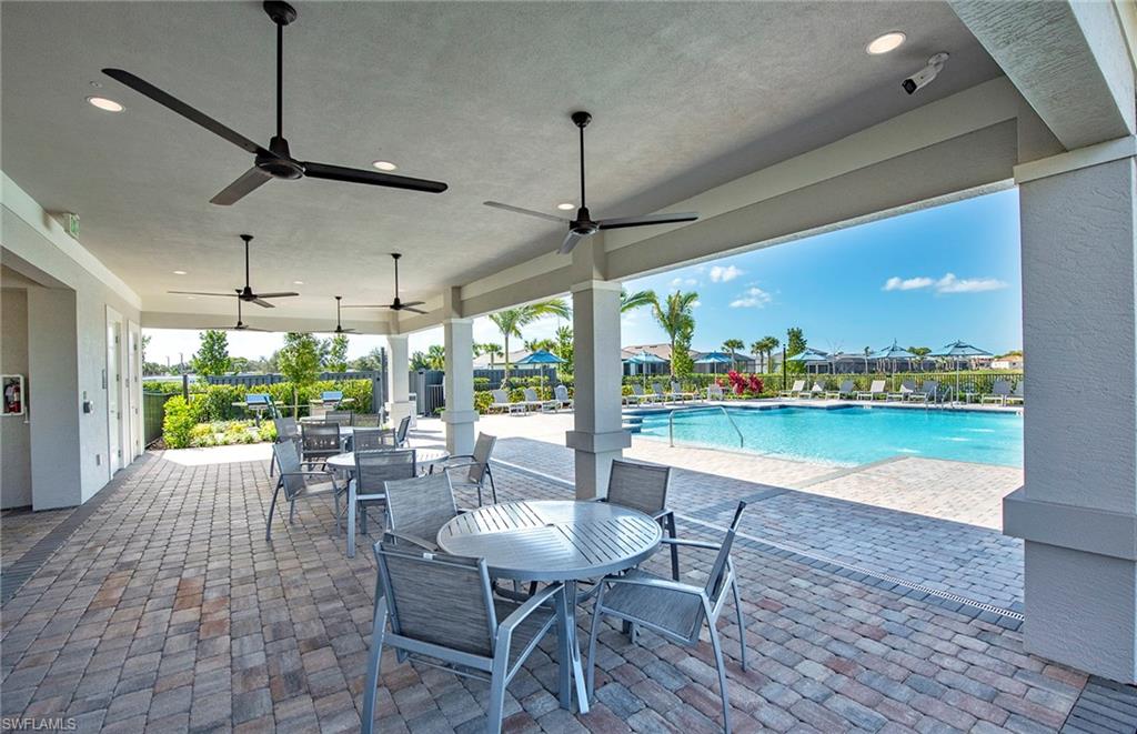 2142 Yellowfin Circle Naples, FL 34114 - Photo 28 of 31 a view of a dining room with furniture window and outside view