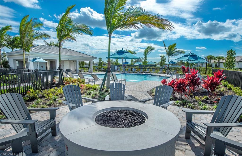 2142 Yellowfin Circle Naples, FL 34114 - Photo 30 of 31 a view of a chairs and table in patio