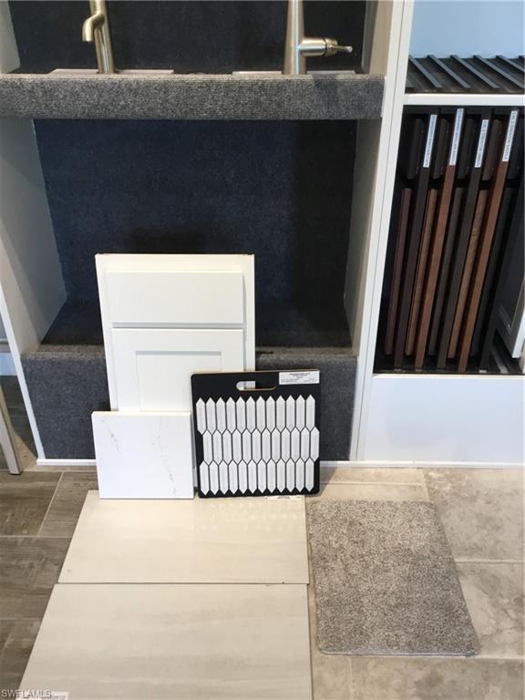 2142 Yellowfin Circle Naples, FL 34114 - Photo 3 of 31 a living room with a couch and a fireplace