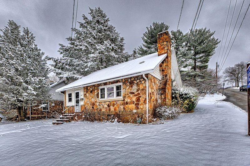 615 West 4th Avenue Derry, PA 15627 - Photo 1 of 28 a front view of house with yard and trees around