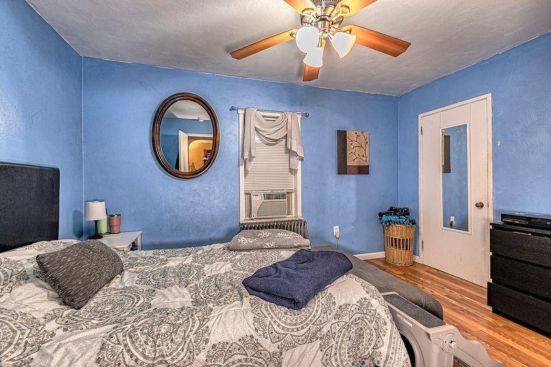 615 West 4th Avenue Derry, PA 15627 - Photo 14 of 28 a bedroom with a bed and a chandelier