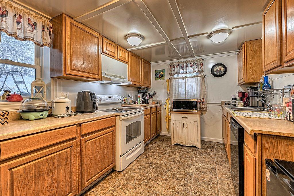 615 West 4th Avenue Derry, PA 15627 - Photo 5 of 28 a kitchen with stainless steel appliances granite countertop a sink and cabinets