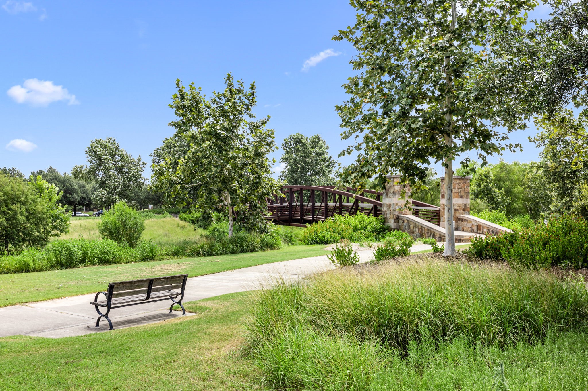 27642 Linden Ridge Lane Fulshear, TX 77441 - Photo 39 of 42 Within the nature reserve are benches, walking trails, and charming bridges over meandering creeks, offering residents a peaceful setting to enjoy nature, unwind, and explore the scenic surroundings.