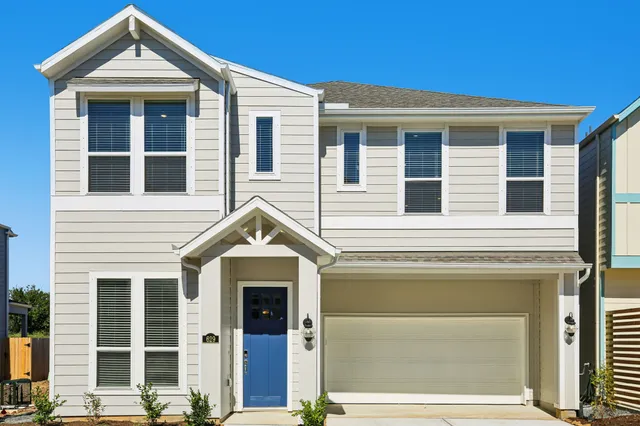 a view of a room with wooden floor and window