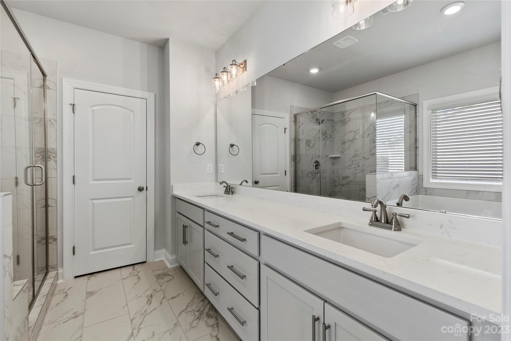 745 Sawgrass Rdg Court Rock Hill, SC 29732 - Photo 8 of 19 a bathroom with double sink and a mirror