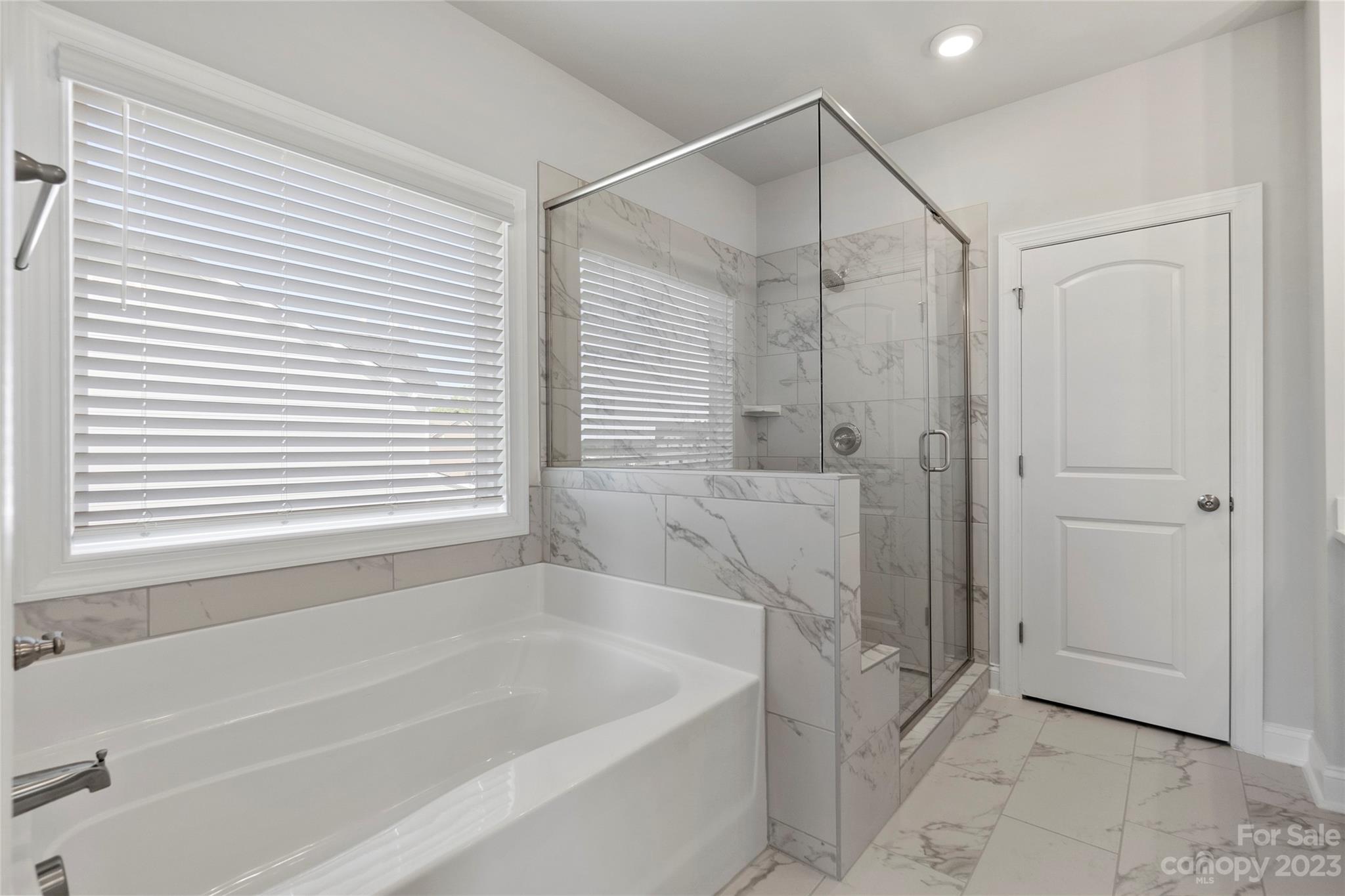 745 Sawgrass Rdg Court Rock Hill, SC 29732 - Photo 9 of 19 a bathroom with a bathtub and a shower