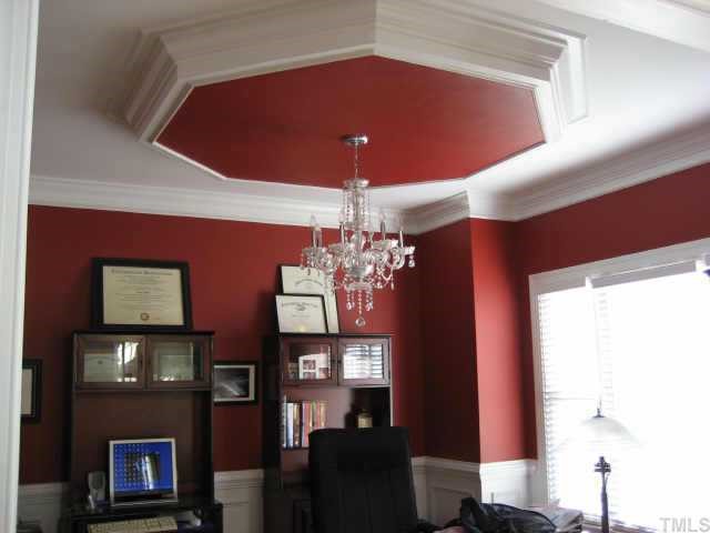 1132 Coram Fields Road Wake Forest, NC 27587 - Photo 3 of 10 Formal dining room with stunning, deep moldings-inverted tray with double crown-chair rail picture molding-7 1/4 baseboards box windows~All crystal chandelier