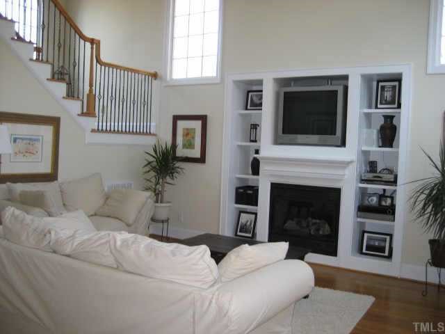 1132 Coram Fields Road Wake Forest, NC 27587 - Photo 5 of 10 Great rm features a wall of built-ins all wired w/surround sound for several rms including outside~ All floors either hardwoods or tile downstairs