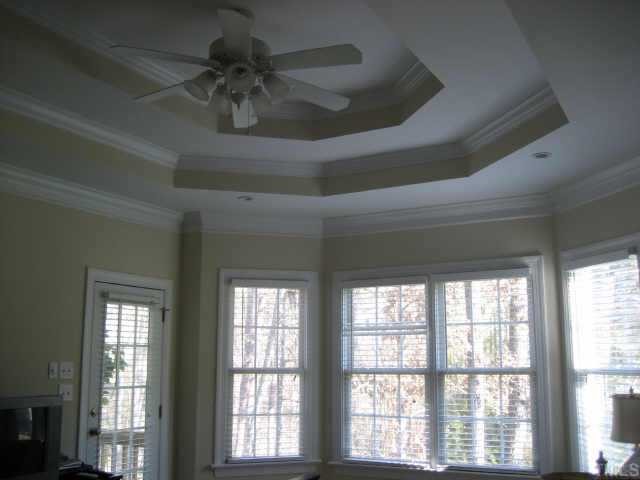 1132 Coram Fields Road Wake Forest, NC 27587 - Photo 8 of 10 Master is down and nestled at rear of the home w/dramatic tripple tray-bayed window & french door leading to private screened porch~bath features his/her WI closets and a lg separate tiled shower, & double vanites.