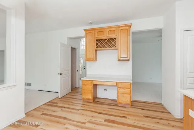 a view of a room that has a bed and a window