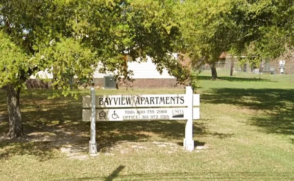 a sign broad on the side of a road