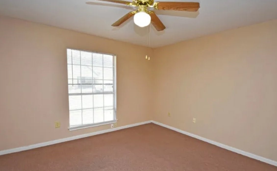 1803 Gray Street Palacios, TX 77465 - Photo 5 of 7 an empty room with a window