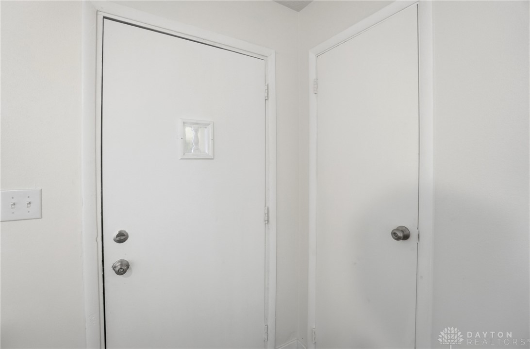 1923 Portage Path Springfield, OH 45506 - Photo 5 of 40 Clean white walls frame a functional interior door, offering privacy and direct access within the property.