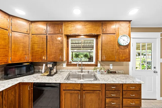 a kitchen with a sink and a window