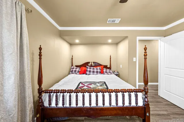 a bedroom with a bed and a dresser