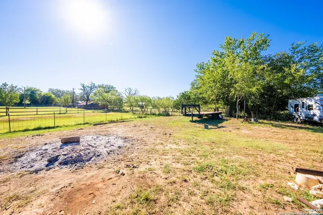 a view of a swimming pool and an outdoor space