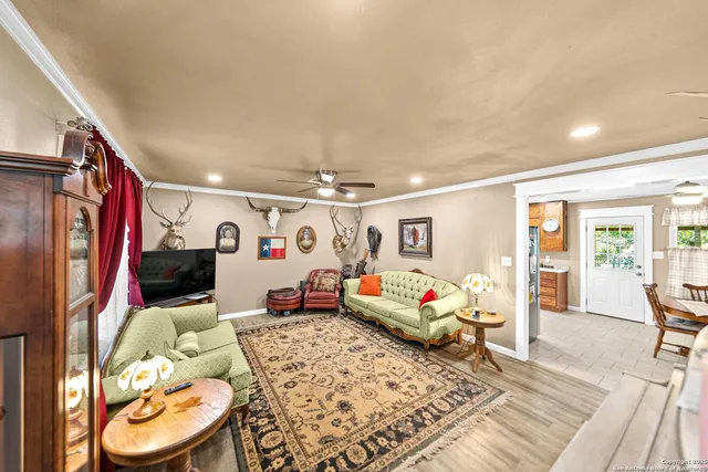 a bedroom with furniture and a flat screen tv