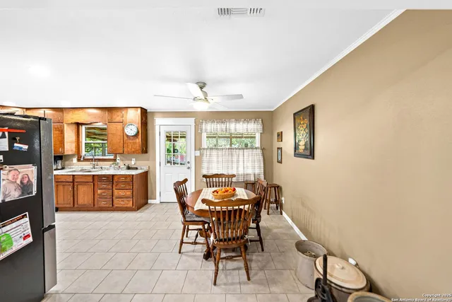 a dining room with furniture and window