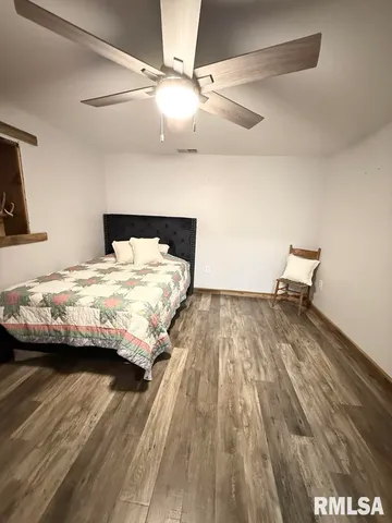 a bedroom with a bed and a table