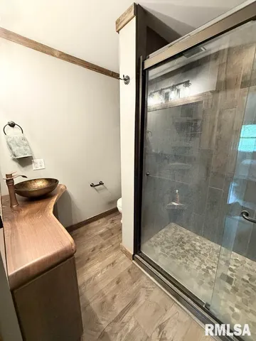 a bathroom with a toilet and a shower
