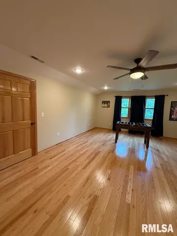 a view of a livingroom with wooden floor