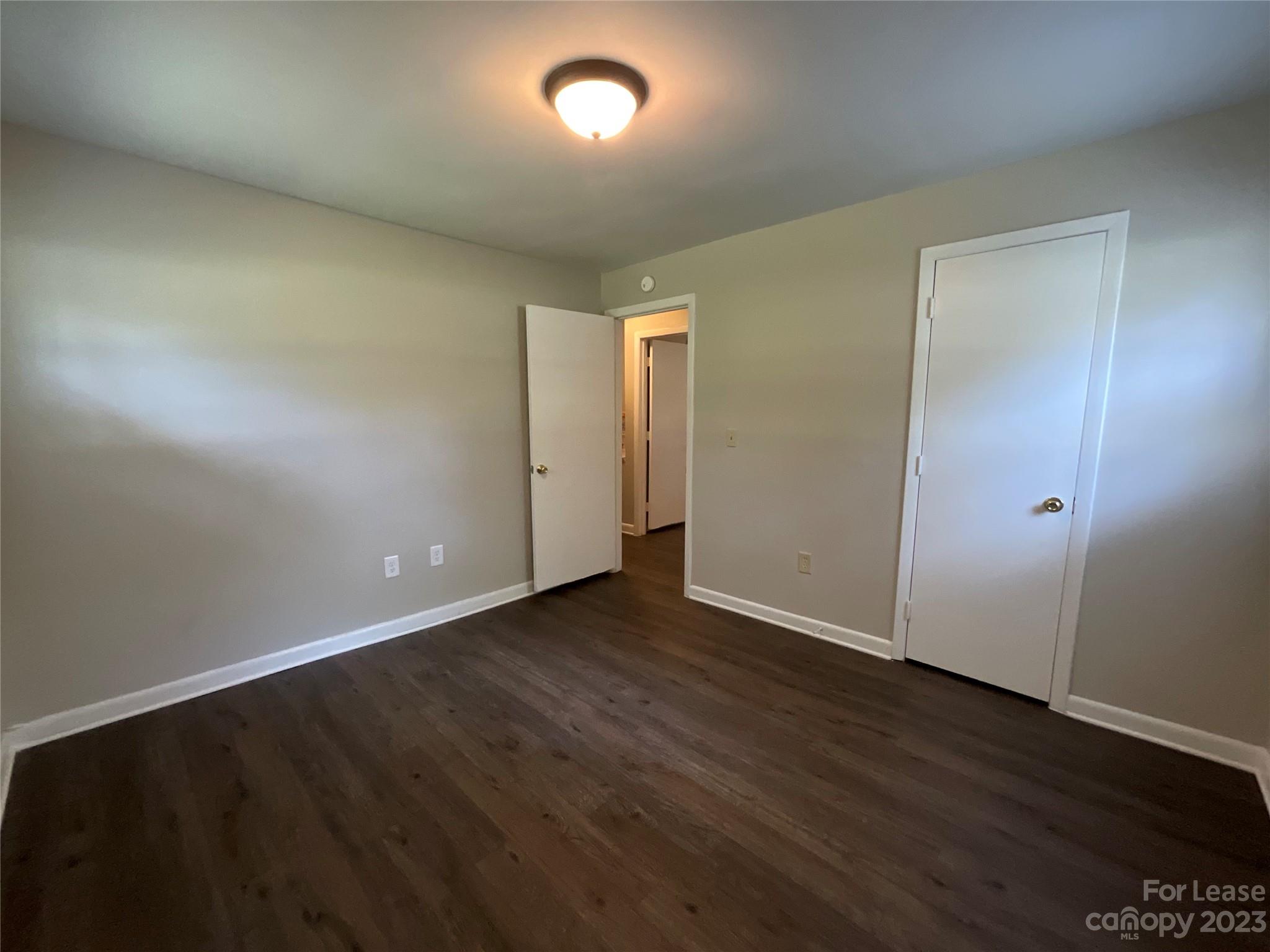 2006 Airport Road, Unit B Salisbury, NC 28147 - Photo 12 of 12 an empty room with wooden floor and windows
