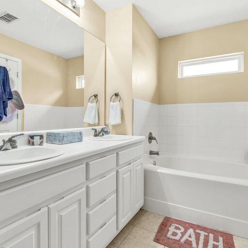24 South Sand Palm Road, Unit 48 Freeport, FL 32439 - Photo 19 of 27 a bathroom with a bathtub a sink and a mirror