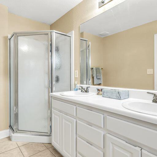 24 South Sand Palm Road, Unit 48 Freeport, FL 32439 - Photo 20 of 27 a bathroom with a double vanity sink and mirror