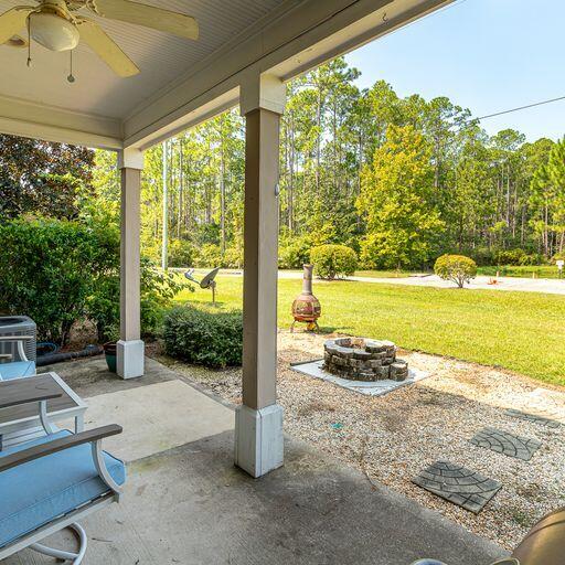 24 South Sand Palm Road, Unit 48 Freeport, FL 32439 - Photo 21 of 27 a view of a room with a floor to ceiling window and an outdoor view
