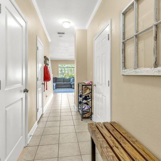 24 South Sand Palm Road, Unit 48 Freeport, FL 32439 - Photo 5 of 27 a hallway with wooden floor electronic appliances and a window