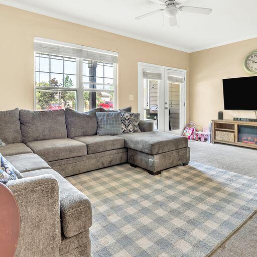 24 South Sand Palm Road, Unit 48 Freeport, FL 32439 - Photo 6 of 27 a living room with furniture and a flat screen tv