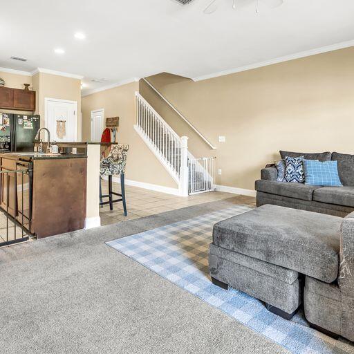 24 South Sand Palm Road, Unit 48 Freeport, FL 32439 - Photo 7 of 27 a living room with furniture and a table