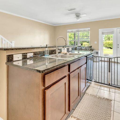 24 South Sand Palm Road, Unit 48 Freeport, FL 32439 - Photo 9 of 27 a kitchen with stainless steel appliances granite countertop a sink stove and cabinets